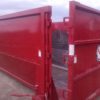 Side image of red 30 yard dumpster with door for rent