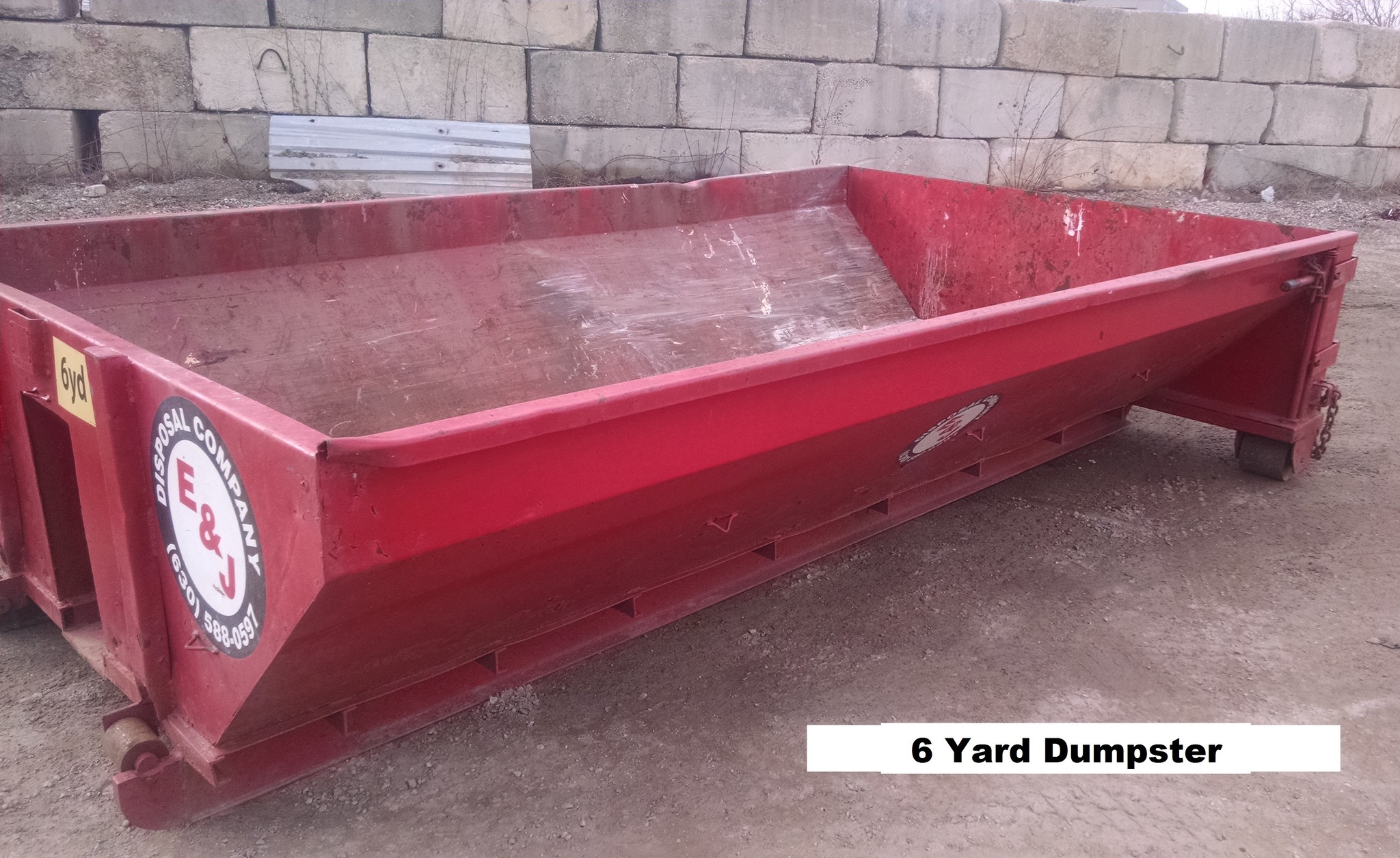 A photo of a 6 yard dumpster in Aurora, IL, from E&J Disposal assisting in a residential cleanout project.
